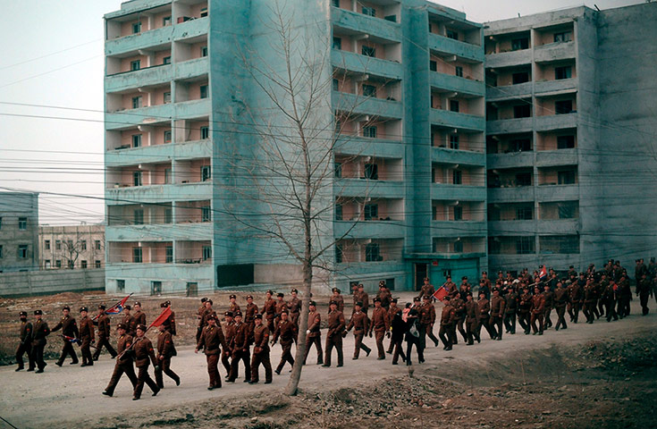Longer view: A North Korean soldiers are seen from the window of a train