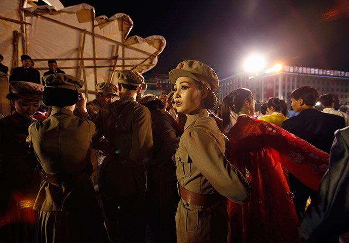 Longer view: A dancer dressed as a soldier takes part in gala show in Pyongyang