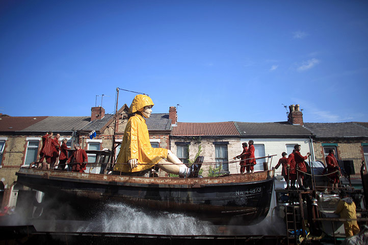 Liverpool Royal de Luxe: The Little Girl Giant Marionette makes her way through the streets