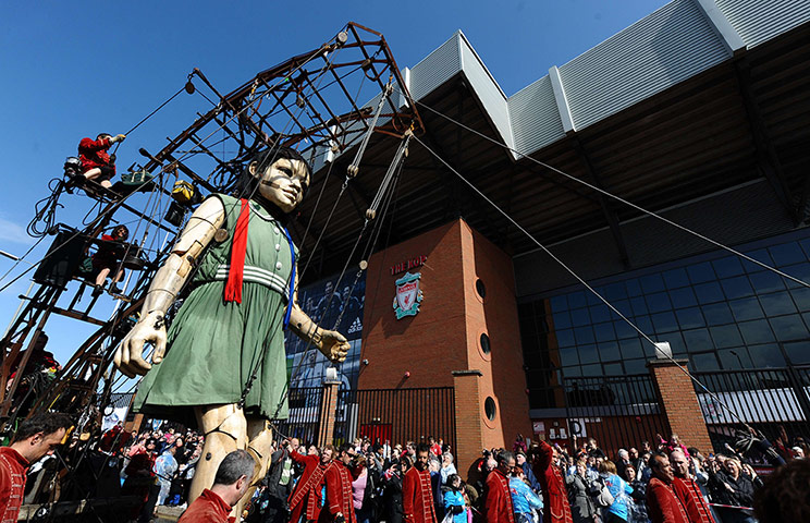 Liverpool Royal de Luxe: A giant puppet walks past Anfield Stadium