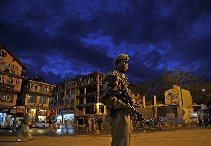 24 hours: India: A Jammu and Kashmir Armed Police (JKAP) soldier stands guard