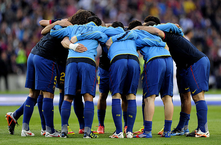 El Clasico: The Barcelona players form a huddle before kick-off