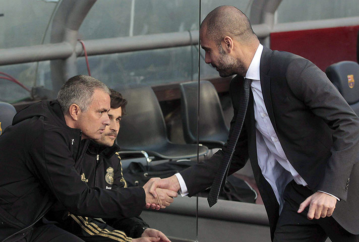 El Clasico: The two managers shake hands before the game