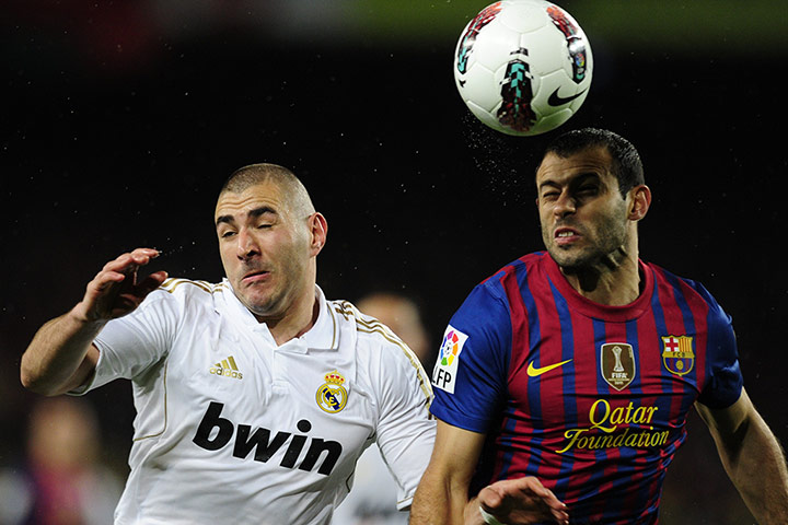 El Clasico update: Karim Benzema and Javier Mascherano go up for a header 
