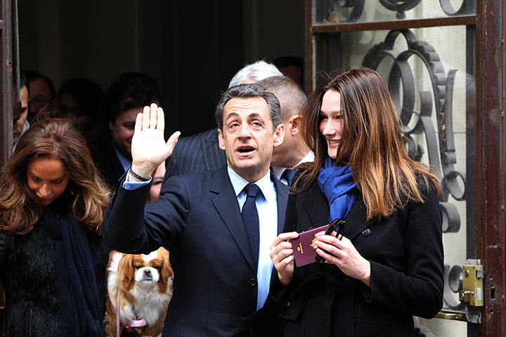 French elections: Sarkozy and his wife Carla Bruni-Sarkozy arrive to cast their vote in Paris