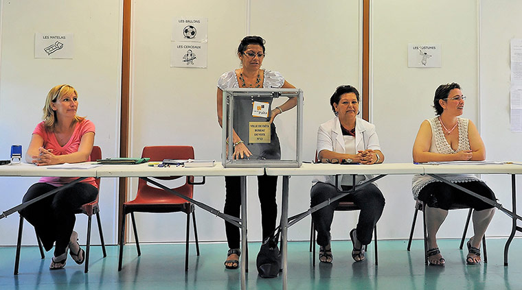 French elections: Electoral workers in a polling station in Noumea, New Caledonia