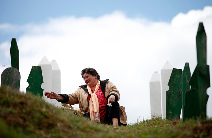 24 hours: Vlasenica, Bosnia: A Bosnian Muslim woman cries before a funeral