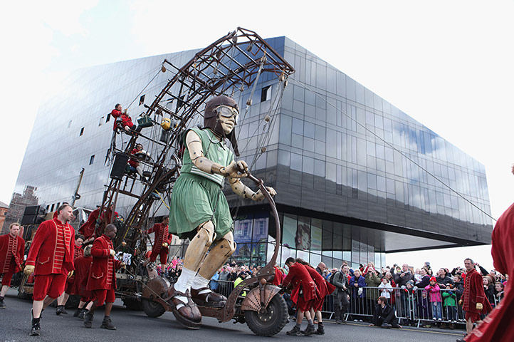 Liverpool Puppets: The little girl giant rides her bike