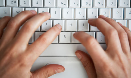 Hands Writing On A Computer Keyboard Close-up.