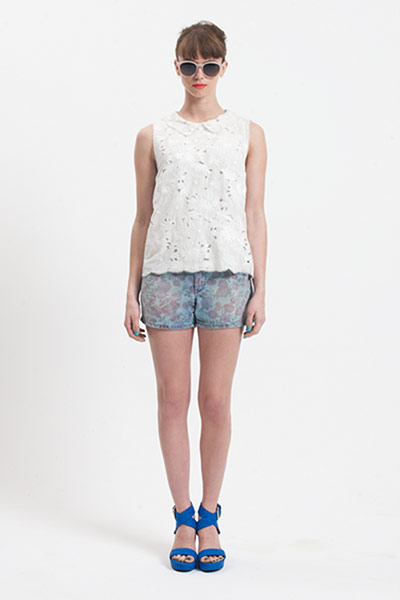 All Ages: Danielle wears a white shirt and  demin floral shorts.