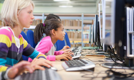 Serious students using computers in school computer lab