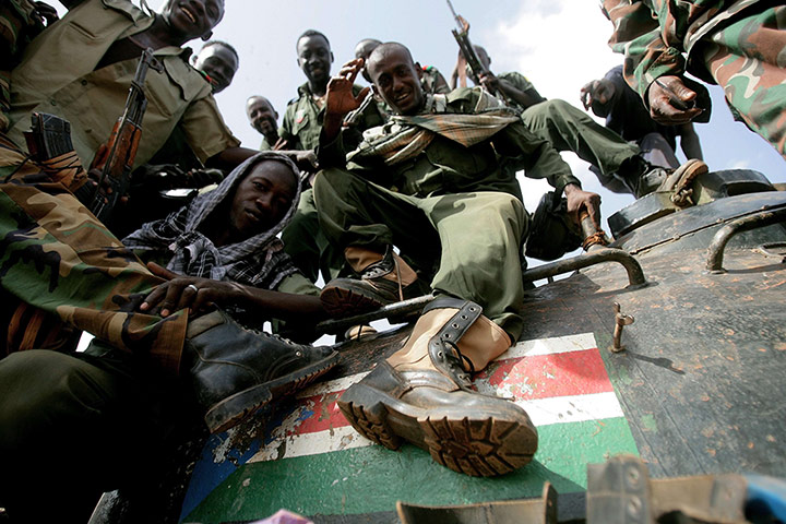 Picture desk live: Sudanese soldiers strike a pose for the camera