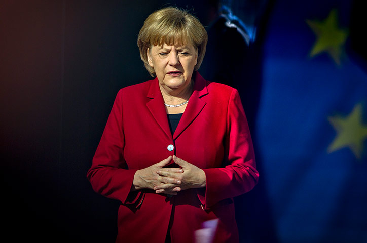 Picture desk live: German Chancellor Merkel waits for Grand Duke Henri of Luxembourg