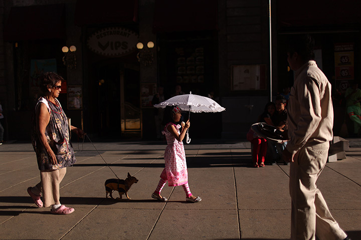 24 hours in pictures: Alejandra Mora walks followed by her grandmother in downtown Mexico City