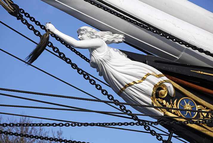 Cutty Sark: Figurehead of the Cutty Sark Clipper Ship holding hair from a horse's tail