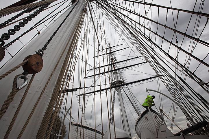 Cutty Sark photo call: A workman makes final adjustments to the rigging on the Cutty Sark
