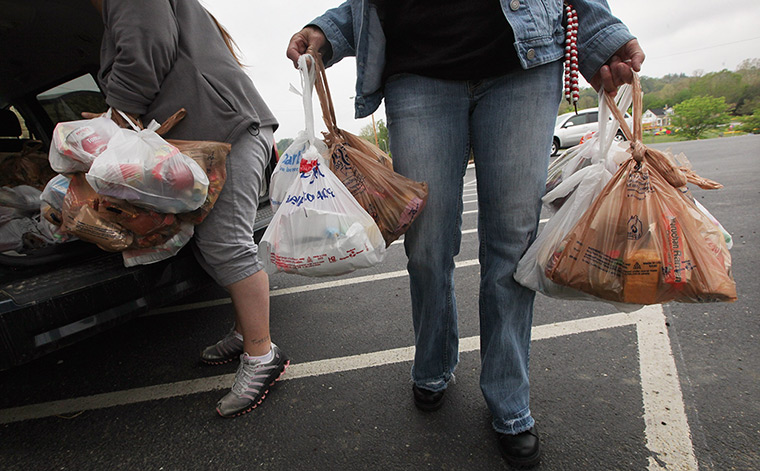 Booneville, Kentucky: Owsley County Outreach Centre workers carry food to be delivered