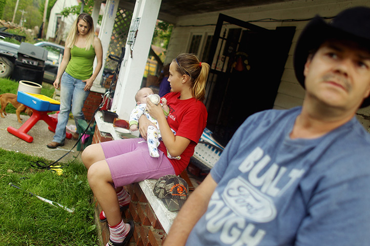 Booneville, Kentucky: Family member gather on the porch