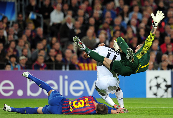 Barcelona v Chelsea: Victor Valdes flattens both Gerard Pique and Didier Drogba