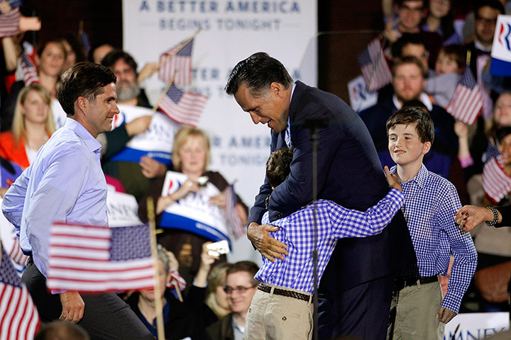 Picture desk live: Mitt Romney gets a hug from his grandson