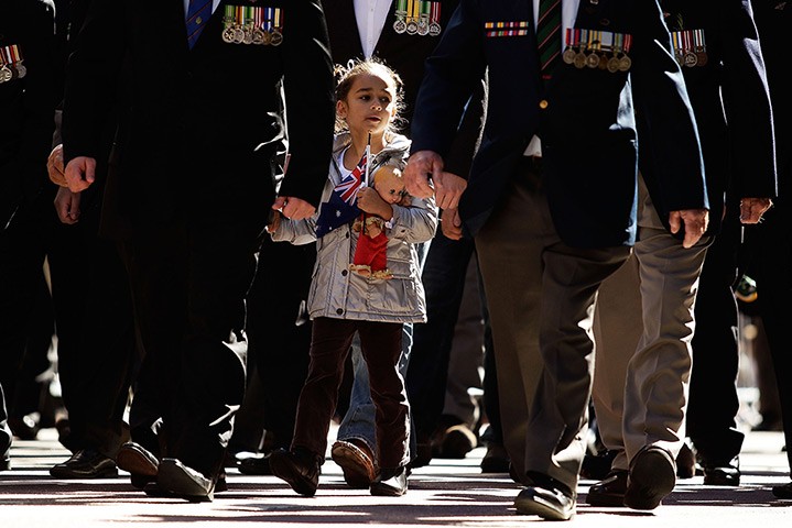 24 hours: Sydney, Australia: A young girl marches along George Street on ANZAC Day 