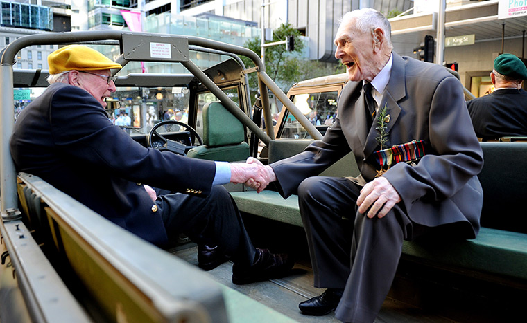 Anzac Day: Second World war veterans shake hands in Sydney