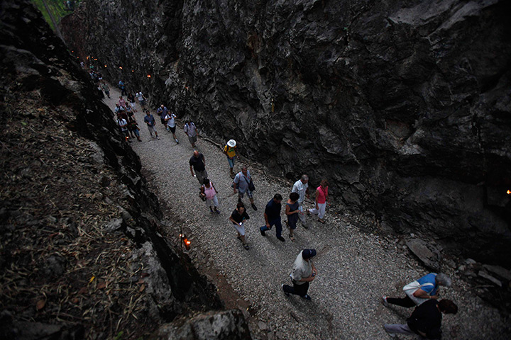 Anzac Day: Australians walk along Hellfire Pass after a memorial ceremony in Thailand