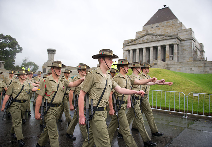 Anzac Day: Soldiers march past the Shrine of Remembrance in Melbourne, Australia