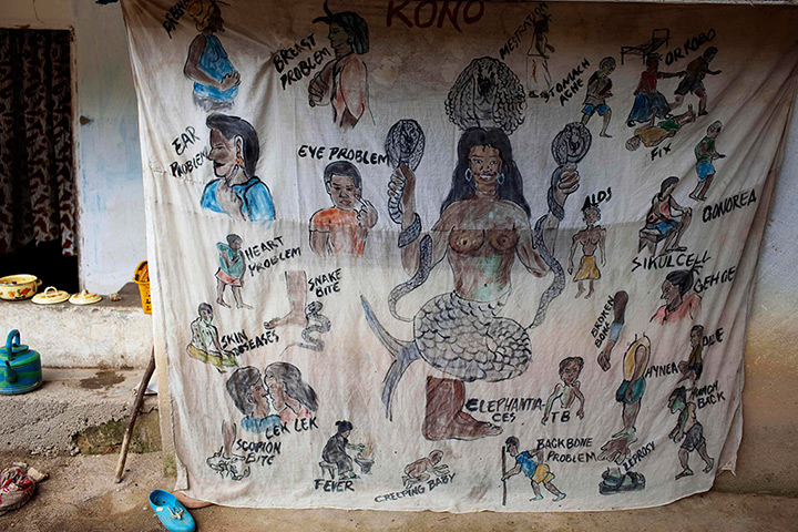 Sierra Leone after Taylor: A sheet advertising a traditional medicine doctor's services hangs outside