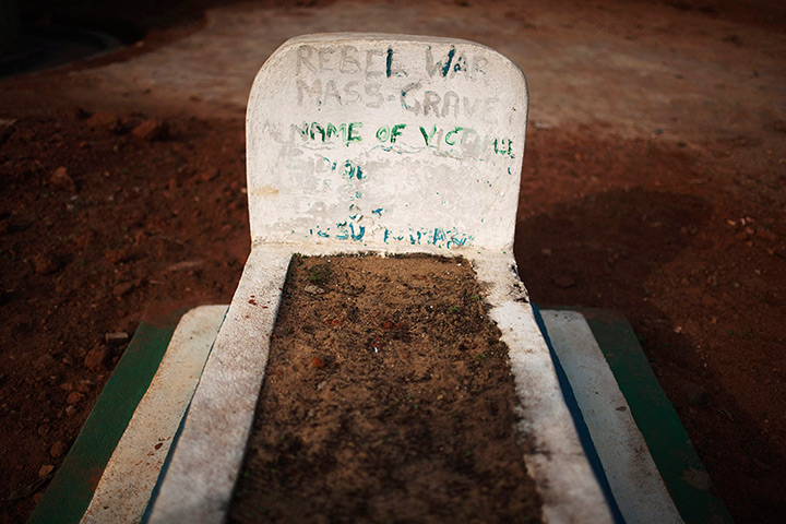 Sierra Leone after Taylor: A headstone marks a mass grave of rebel victims in the village of Bomaru