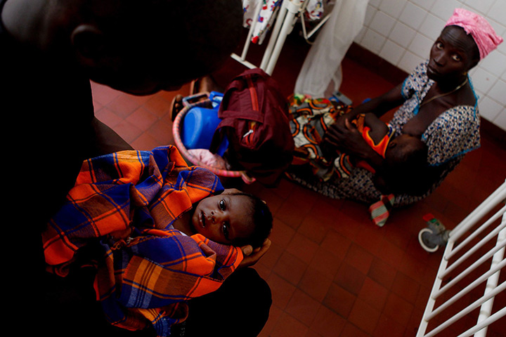 24 hours: Bissau, Guinea-Bissau: Parents with their babies in paediatrics department