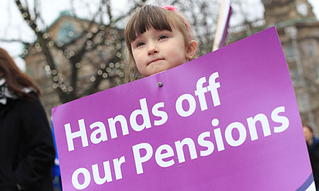 A girl holds a protest placard during a public sector strike over pensions 