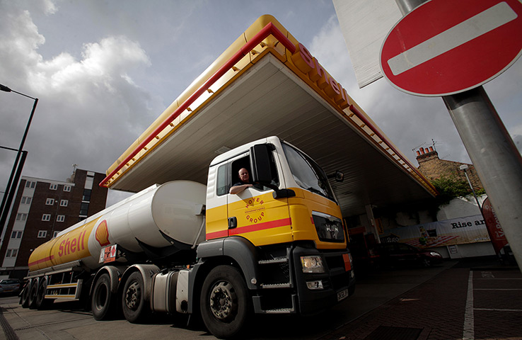 Week in Business: A Shell oil tanker delivers fuel to a petrol station in London