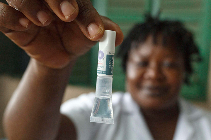 Week in Business: A nurse holds a vial of rotavirus vaccine made by GlaxoSmithKline