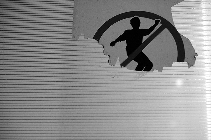 Your Pictures: Twist: No Skating sign half covered by broken plastic