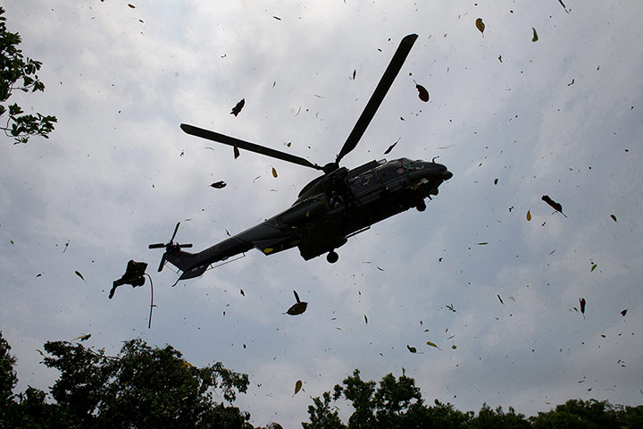 24 hours: Peng Chau, China: A Hong Kong government rescue helicopter prepares to land