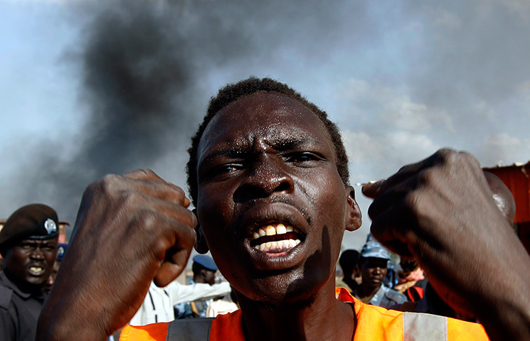 South Sudan: A man gestures at a market burnt in an air strike by the Sudanese air force