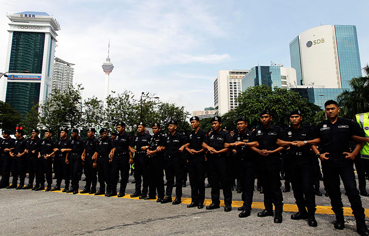 Kuala Lumpur: Police in Kuala Lumpur form a human barricade 