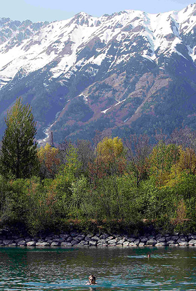24 hours: Innsbruck, Austria: People swim in an artificial lake