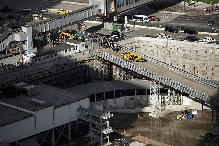 World Trade Centre: 27 April 2006: An excavator descends into Ground Zero