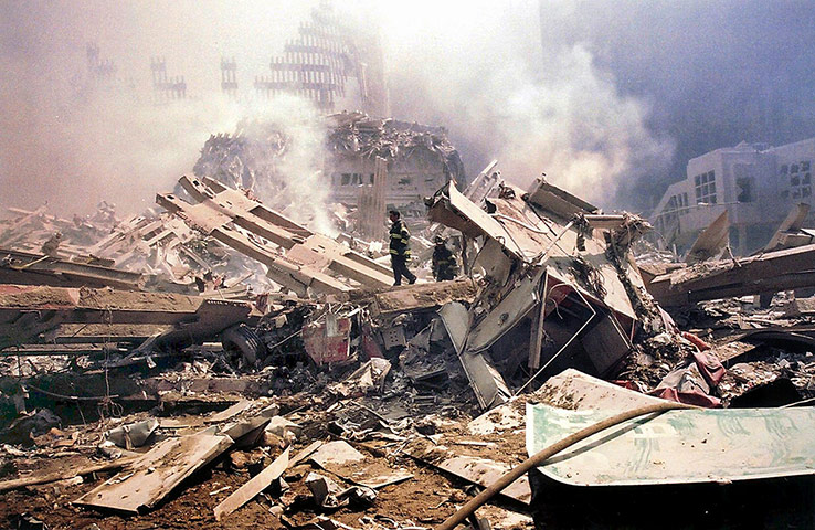 World Trade Centre 11 September 2001 Firemen walk around Ground Zero