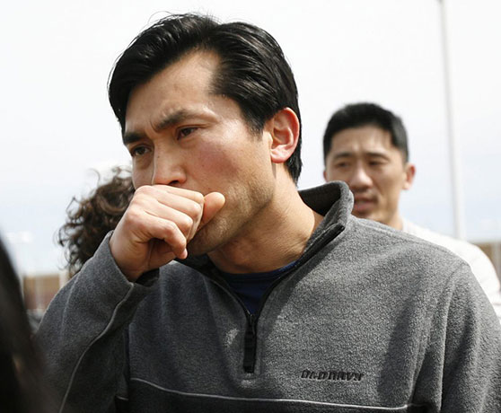 Oakland shootings: Timothy Yi, a Pastor at Hayward Korean Baptist Church, stands outside Oikos