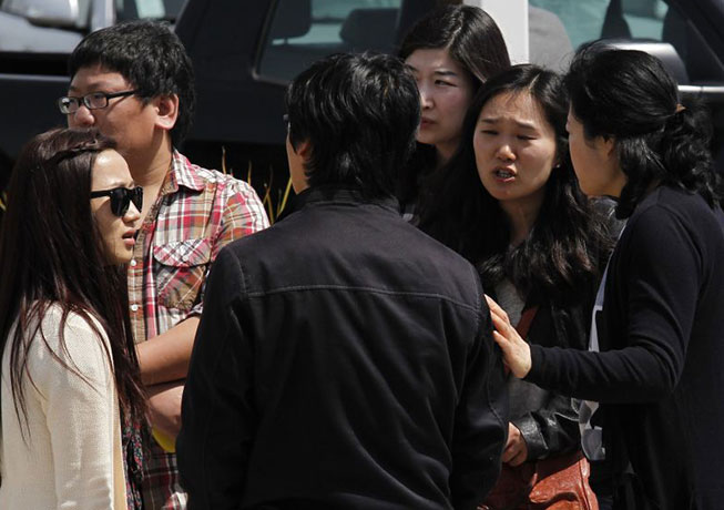 Oakland shootings: Students and bystanders after the Oakland shooting at Oikos University.