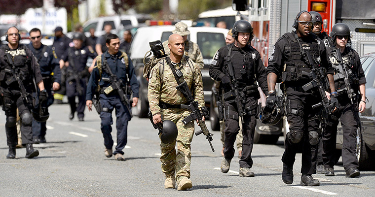 Oakland shooting: Law enforcement officers leave Oikos University 