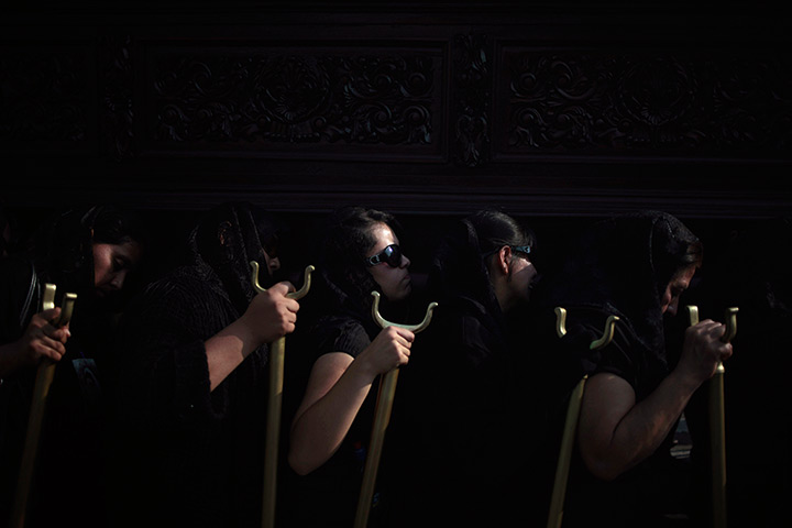 24 hours in pictures: Women carrying statue of Jesus Nazareno de las Tres Potencias, Guatemala