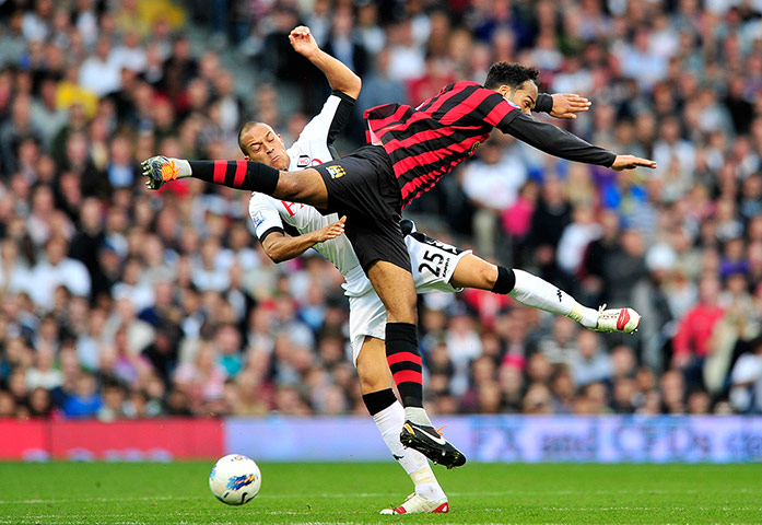 City versus United: Fulham's Bobby Zamora vies with Manchester City's Joleon Lescott