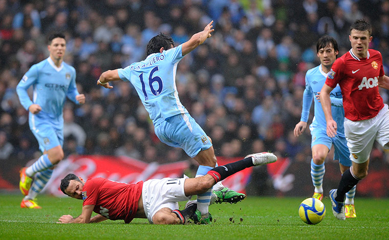 City versus United: Ryan Giggs fouls Sergio AgueroRyan Giggs fouls Sergio Aguero