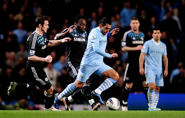 City versus United: Manchester City's Carlos Tevez is pursued by Michael Essien & Frank Lampard