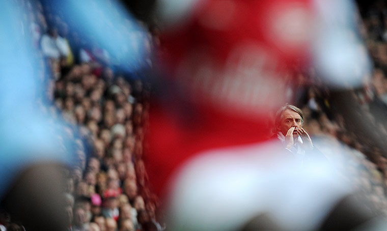 City versus United: Roberto Mancini reacts during the match between Arsenal and Manchester City