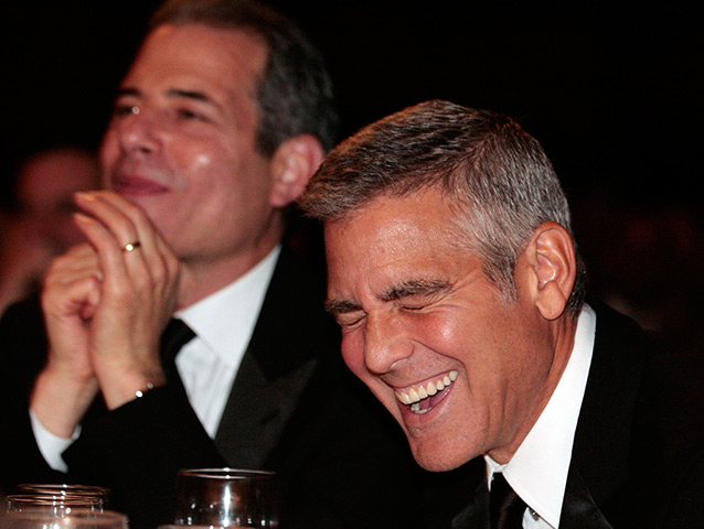 White House dinner: Actor George Clooney laughs while President Barack Obama speaks 